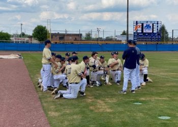 Shady Spring head coach Jordan Meadows huddles with his team after an 11-5 win over Princeton at Hunnicutt Field on Saturday.