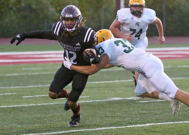 (Brad Davis/For LootPress) Woodrow Wilson's Elijah Redfern tries to get around Greenbrier East's Jarrett McHale Friday night in Beckley.