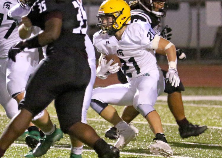 (Brad Davis/For LootPress) Greenbrier East's Ian Cline carries the ball against Woodrow Wilson Sept. 3 in Beckley.