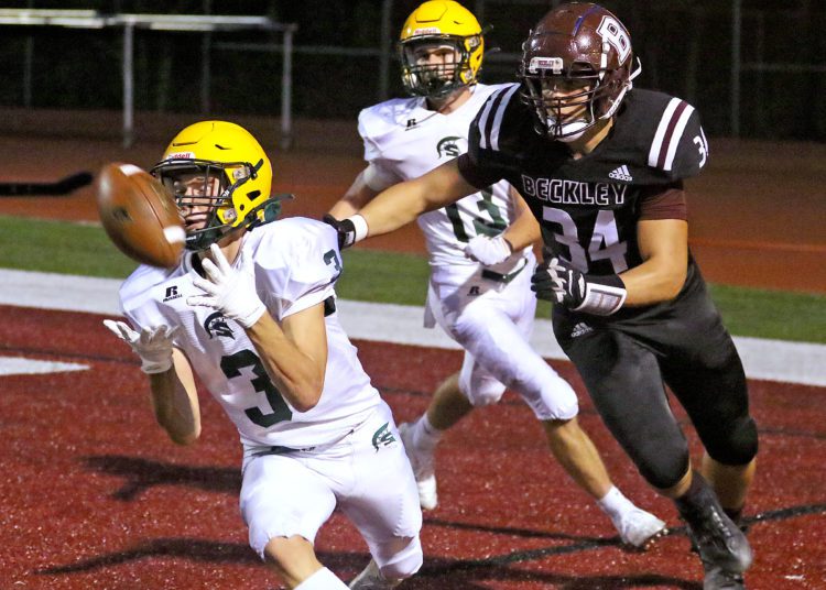 (Brad Davis/For LootPress) Greenbrier East defender Bryson Ormsbee slides in front of intended Woodrow Wilson receiver Michael Miller to intercept an underthrown pass in the endzone Friday night in Beckley.