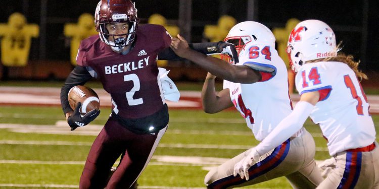 (Brad Davis/For LootPress) Woodrow Wilson's Keynan Cook gets around Morgantown defender Malik M'bayo (#64) Sept. 24, 2021 in Beckley.