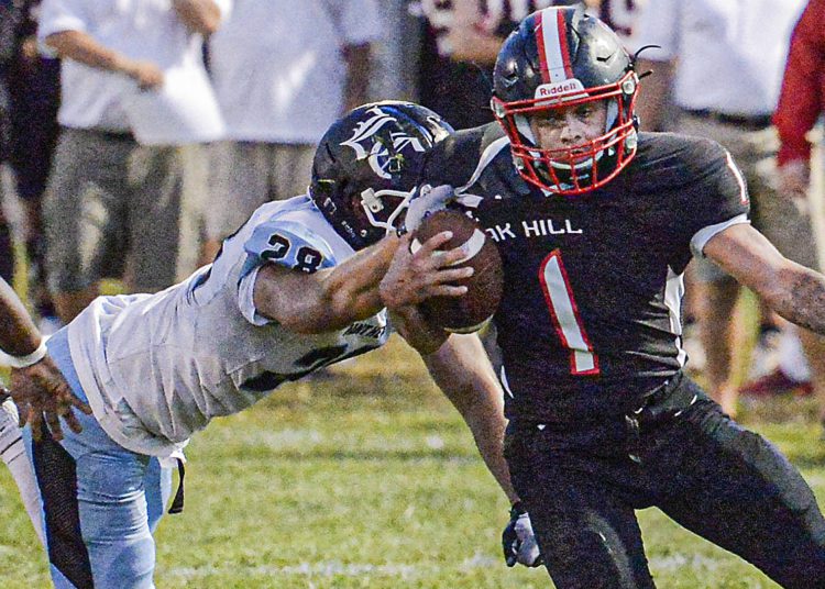 Oak Hill’s Omar Lewis picks up yards against Lincoln County last season in Oak Hill. (F. Brian Ferguson/Lootpress).