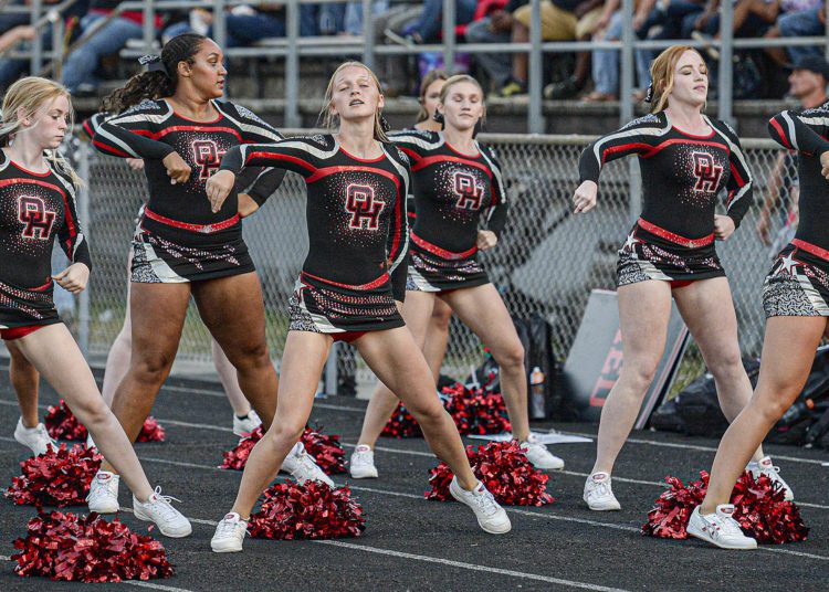 The Red Devil cheerleaders get the home fans into the game on Friday in Oak Hill. (F. Brian Ferguson/Lootpress).