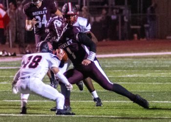 Beckley's Maddex McMillen carries the ball against Oak Hill on Oct. 30, 2021 in Beckley. (File Photo by Heather Belcher)