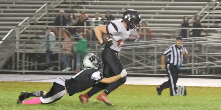 File Photo - Liberty's Logan Dodrill carries the ball against Westside on Oct. 8 in Clearfork (Renee Richardson)