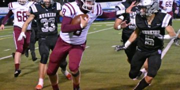 Bluefield's Ryker Brown carries the ball during Friday's win over North Marion (Tammy Shriver/The Exponent Telegram)