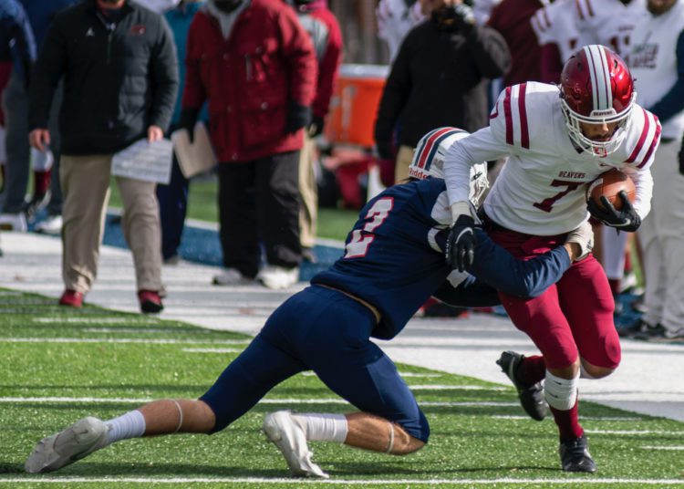 Independence's Cyrus Goodson tackles Bluefield's Jacorian Green during their Class AA semifinal game Friday Nov. 26 in Coal City. (Heather Belcher/Lootpress)