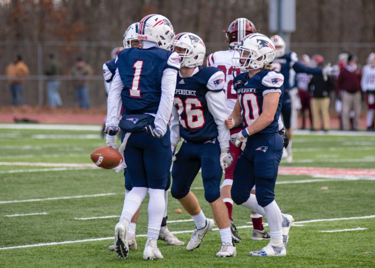 Independence cornerback Trey Bowers (No. 1) celebrates with his teammates after intercepting Bluefield QB Ryker Brown in the Class AA semifinal Nov. 26 in Coal City. (Heather Belcher/Lootpress)