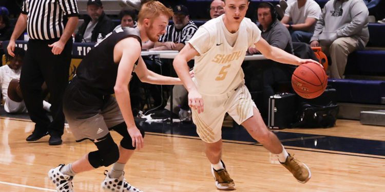 Shady Spring's Cole Chapman drives past Westside's Austin Cline during a game on Dec. 7. (Karen Akers/File Photo)