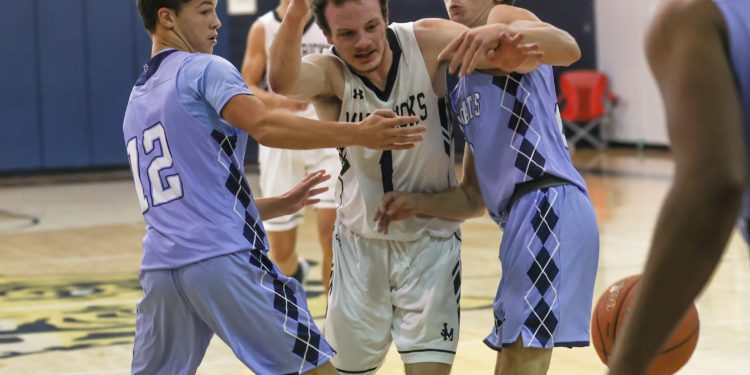 James Monroe's Shad Sauvage splits a double team during a scrimmage at Shady Spring on Dec. 5. (Karen Akers)