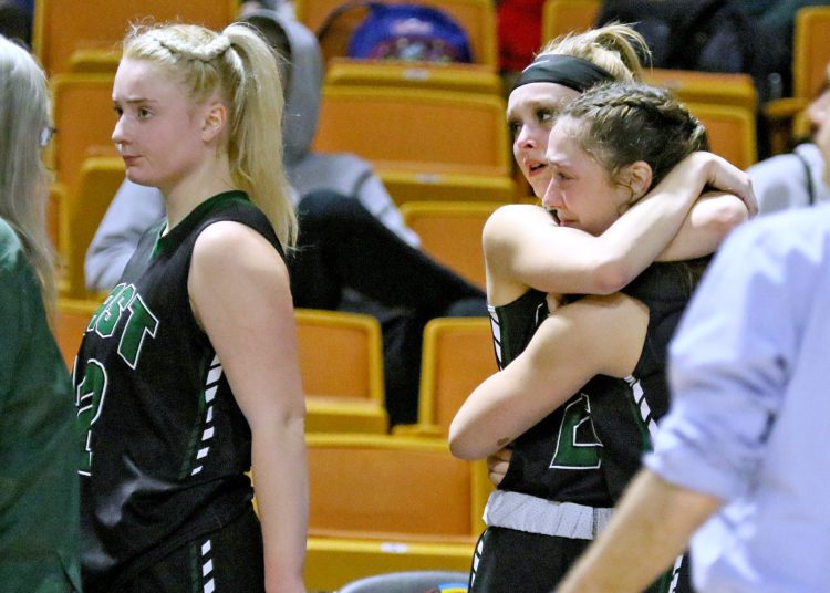 Wyoming East's Kayley Bane hugs teammate Colleen Lookabill during the Class AA state championship game at the Charleston Coliseum and Convention Center.

(Brad Davis/For LootPress) Wyoming East v Parkersburg Catholic, State Tournament Class AA Championship Game, March 12, 2022 in Charleston.