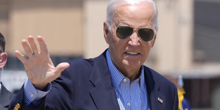 President Joe Biden waves as he arrives to board Air Force One at Andrews Air Force Base, Md., en route to a campaign trip in Madison, Wis., Friday, July 5, 2024. (AP Photo/Manuel Balce Ceneta)