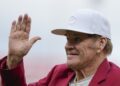 FILE - Former Cincinnati Reds player Pete Rose waves to fans after being introduced during the Reds Hall of Fame Induction Ceremony, July 15, 2023, in Cincinnati. (AP Photo/Darron Cummings, File)