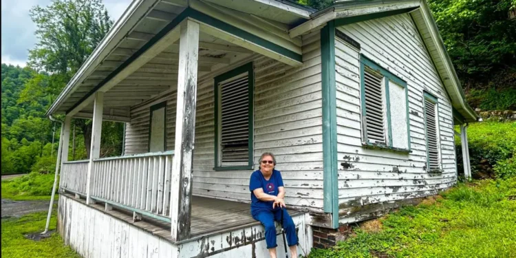 Former Thurmond resident Marilyn Brown sits on the porch of her last residence in Thurmond before moving to Oak Hill after being bought out by the NPS | The “Marilyn Brown House” is one of 19 historic structures proposed for demolition.