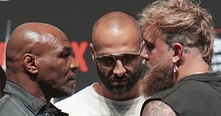 Mike Tyson, front left, and Jake Paul, front right, face off during a news conference ahead of their fight, Wednesday, Nov. 13, fis
2024, in Irving, Texas. (AP Photo/Julio Cortez)